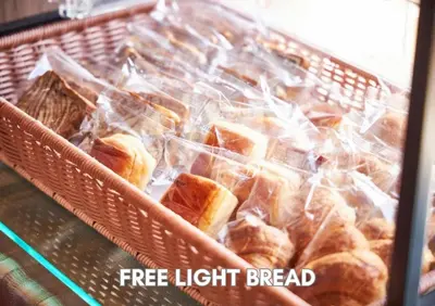 a basket full of bread in plastic bags at Hotel Pasela Living Shinjuku in Tokyo