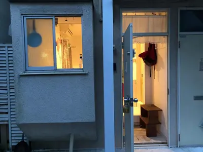 two pictures of a door and a window on a house at minimalist\u7d4c\u5802\u306e\u5c0f\u3055\u306a\u304a\u90e8\u5c4b in Tokyo