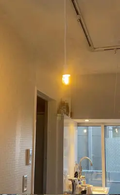 a kitchen with a sink and a light on the ceiling at minimalist\u7d4c\u5802\u306e\u5c0f\u3055\u306a\u304a\u90e8\u5c4b in Tokyo