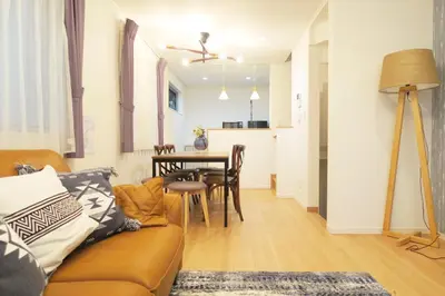 a living room with a couch and a table at Etranger Kaname Cho in Tokyo
