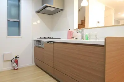 a kitchen with a sink and a counter top at Etranger Kaname Cho in Tokyo