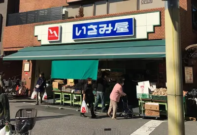 a group of people standing outside of a store at Etranger Kaname Cho in Tokyo
