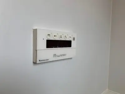 a microwave oven hanging on a white wall at Tokyo Stay House Otsuka --Kitchen-Living-dining-3room-- in Tokyo