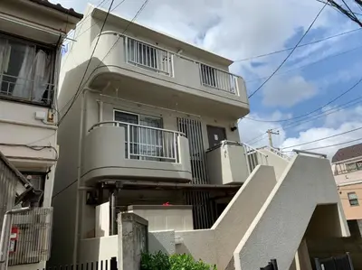 an apartment building with stairs leading up to it at Tokyo Stay House Otsuka --Kitchen-Living-dining-3room-- in Tokyo
