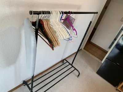 a towel rack with towels on it in a room at Tokyo Stay House Otsuka --Kitchen-Living-dining-3room-- in Tokyo