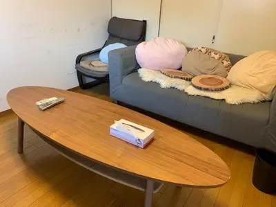a living room with a couch with pillows and a table at Tokyo Stay House Otsuka --Kitchen-Living-dining-3room-- in Tokyo