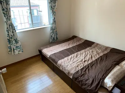 a small bed in a room with a window at Tokyo Stay House Otsuka --Kitchen-Living-dining-3room-- in Tokyo