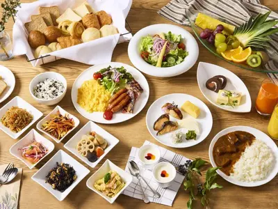 a table with many plates of food on it at Villa Fontaine Grand Tokyo Shiodome in Tokyo
