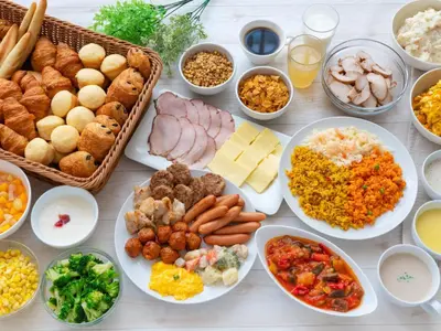 a table topped with lots of different types of food at Villa Fontaine Tokyo Kudanshita in Tokyo