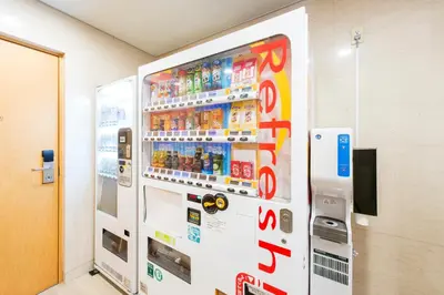 a vending machine in a room with soda at Villa Fontaine Tokyo Hamamatsucho in Tokyo