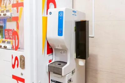 a pay phone in the side of a refrigerator at Villa Fontaine Tokyo Hamamatsucho in Tokyo