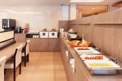 a kitchen with a buffet with food on it at Villa Fontaine Tokyo Hamamatsucho in Tokyo