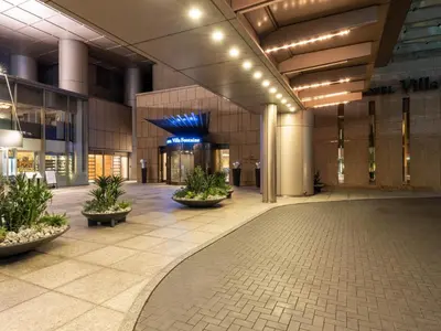 an empty lobby of a building with plants at Villa Fontaine Grand Tokyo Roppongi in Tokyo