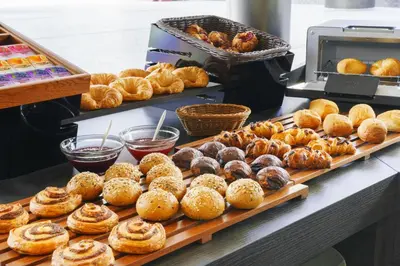 a bunch of pastries on a counter in a bakery at Villa Fontaine Grand Tokyo Tamachi in Tokyo