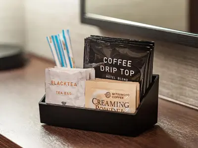 a container of coffee drip tops and a bag of breaking coffee at Villa Fontaine Grand Tokyo Tamachi in Tokyo