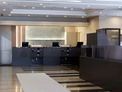 an office with desks and chairs in a lobby at Villa Fontaine Tokyo Otemachi in Tokyo