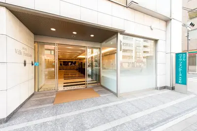an entrance to a building with glass doors at Villa Fontaine Tokyo Otemachi in Tokyo