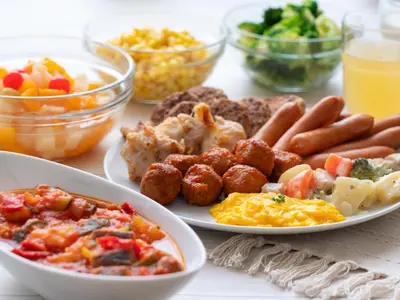 a table with two plates of food with breakfast foods at Villa Fontaine Tokyo Nihombashi Hakozaki in Tokyo