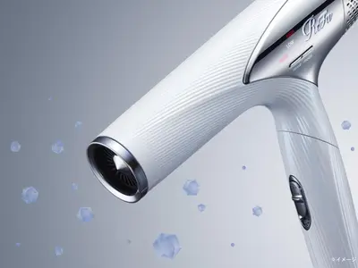 a close up of a white electric toothbrush at Villa Fontaine Tokyo Nihombashi Hakozaki in Tokyo