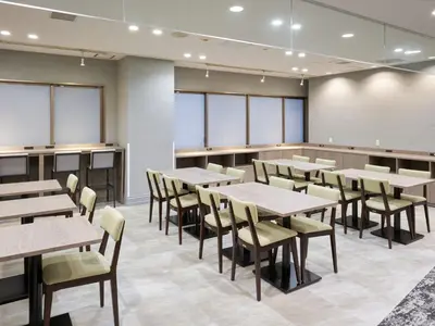 a large dining room with tables and chairs at Villa Fontaine Tokyo Nihombashi Mitsukoshimae in Tokyo