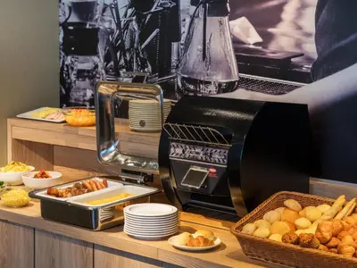 a toaster sitting on top of a counter with food at Villa Fontaine Tokyo Hatchobori in Tokyo
