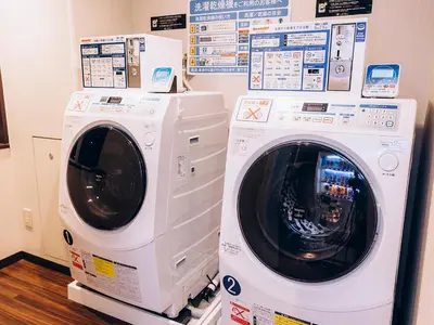 two washing machines are stacked on top of each other at Shinagawa Tobu Hotel in Tokyo
