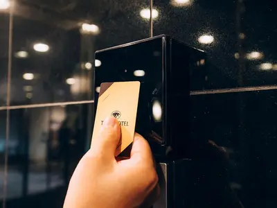 a person holding a card in a light switch at Shinagawa Tobu Hotel in Tokyo