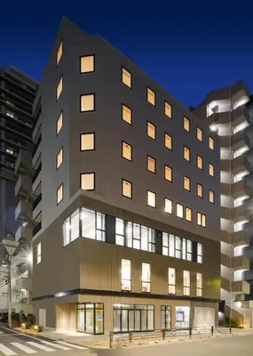 a black building with many windows at night at Tokyo Ueno Youth Hostel in Tokyo