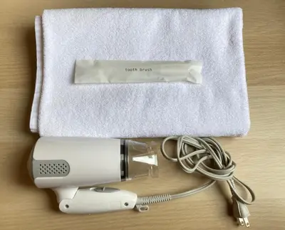 a hair dryer and a hairdryer with a white towel at Tokyo Ueno Youth Hostel in Tokyo