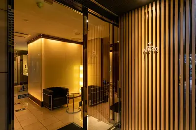 a lobby of a building with a glass door at HOTEL APERTO (Adult Only) in Tokyo