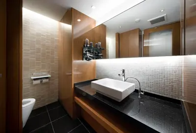 a bathroom with a sink and a toilet at HOTEL APERTO (Adult Only) in Tokyo