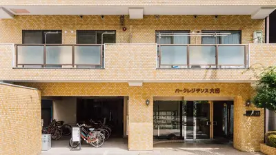 a brick building with bikes parked outside of it at Park Residence Omori in Tokyo