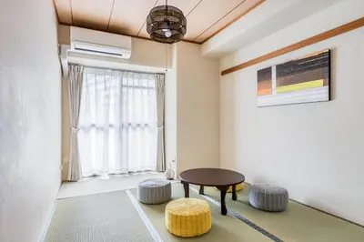 a room with a table and stools and a window at Park Residence Omori in Tokyo