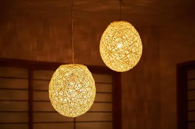 a couple of lights hanging from a ceiling at Ueno Residence Hotel Matsumoto in Tokyo