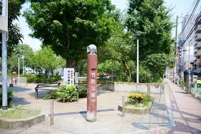 a pole with a statue on it in a park at Ueno Residence Hotel Matsumoto in Tokyo