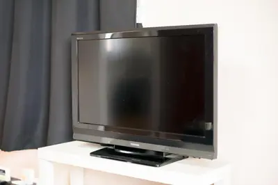 a flat screen tv sitting on a white table at Murata Corpo 301 in Tokyo