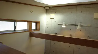 a bathroom with a sink and a mirror and a window at Kanamechō detached house in Tokyo