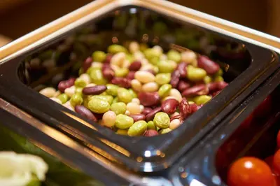 a tray filled with green grapes and other vegetables at Keio Presso Inn Nihonbashi Kayabacho in Tokyo