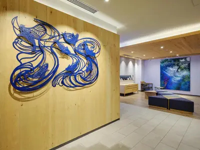 a painting on a wall in a lobby at hotel MONday Premium Ueno Okachimachi in Tokyo