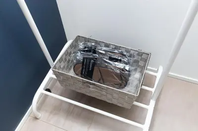 a basket full oftools in the corner of a room at Cross Bridge Ikebukuro in Tokyo