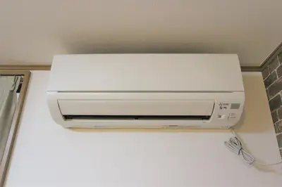 a white air conditioner hanging from a ceiling at Hotel EL Shinjuku 2 in Tokyo