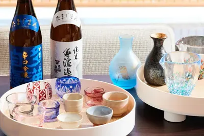 a table with two bottles of wine and glasses at InterContinental Tokyo Bay by IHG in Tokyo