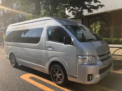 a silver van parked in a parking lot at Hotel EL Shinjuku 1 free parking in Tokyo