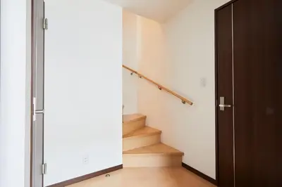 a hallway with stairs and a sliding door at Hotel EL Shinjuku 1 free parking in Tokyo