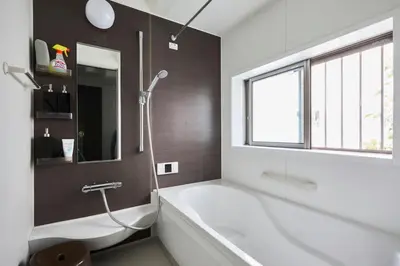 a bathroom with a bath tub and a window at Hotel EL Shinjuku 1 free parking in Tokyo