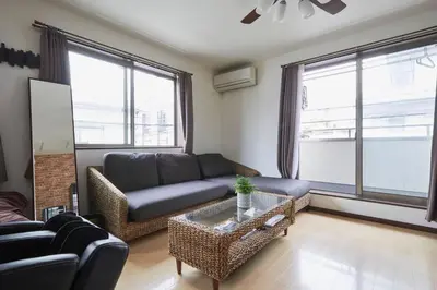 a living room with a couch and a table at Hotel EL Shinjuku 1 free parking in Tokyo