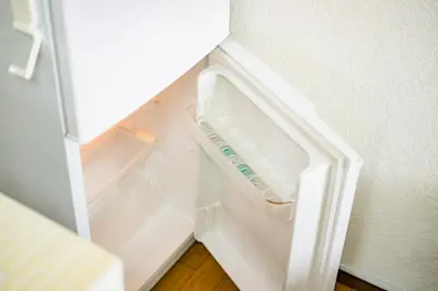 an empty refrigerator with its door open in a room at Murata Corpo / Vacation STAY 4497 in Tokyo