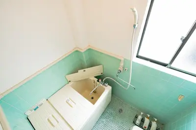 a blue tiled bathroom with a sink and a shower at Murata Corpo / Vacation STAY 4497 in Tokyo
