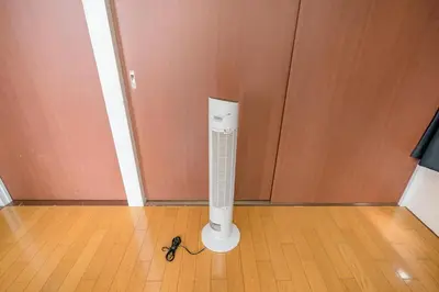 a white heater on a wooden floor next to a door at Murata Corpo / Vacation STAY 4497 in Tokyo