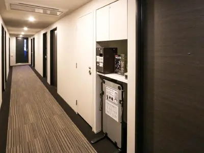 a corridor of an office building with a corridorasteryasteryasteryasteryasteryasteryastery at HOTEL LiVEMAX Shinjuku EAST in Tokyo
